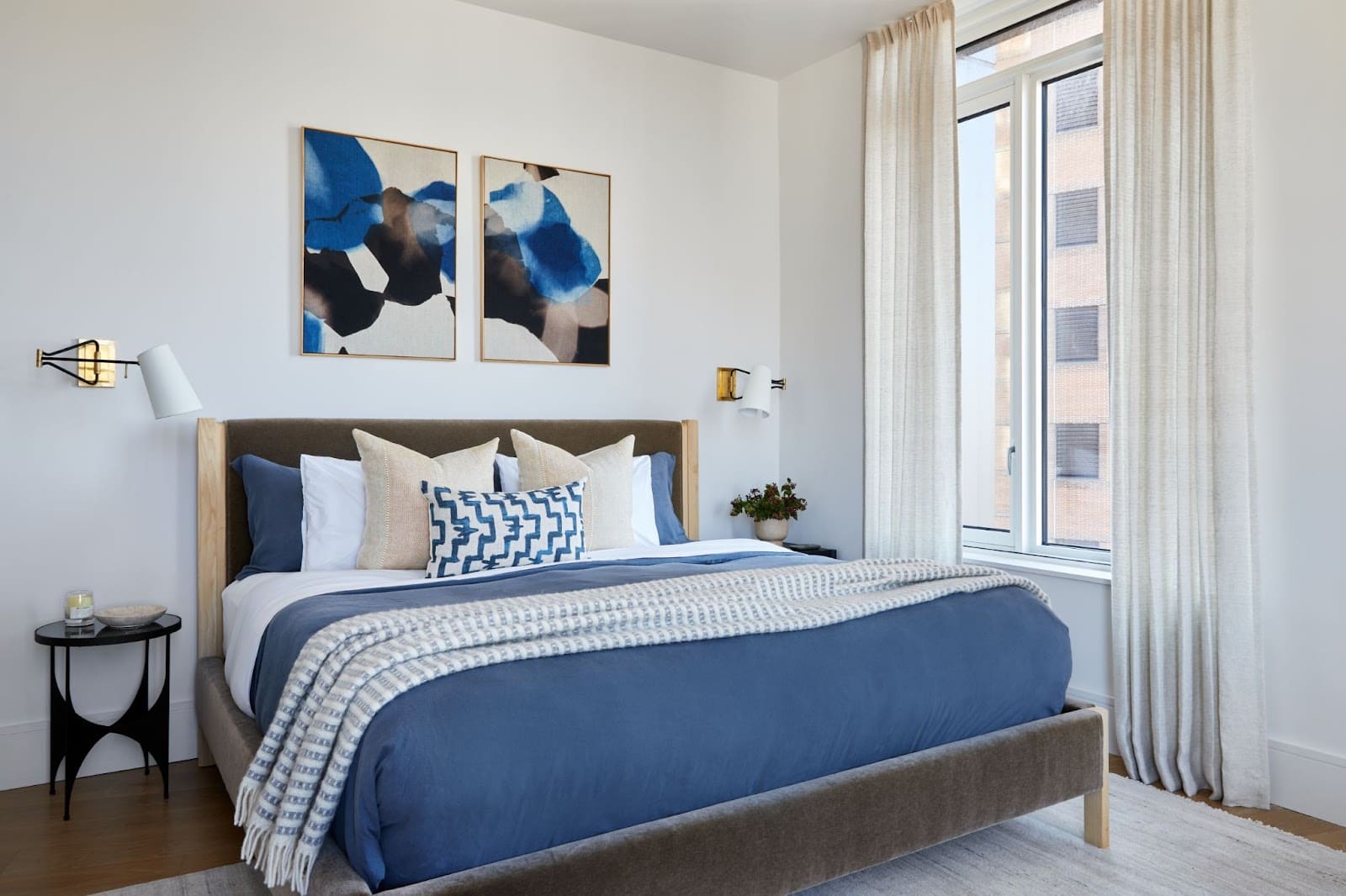 Bedroom design with mohair-upholstered bed in blues, greys, and beiges